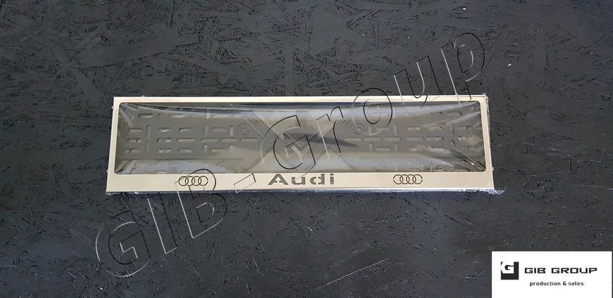 Рамка номерного знаку з написом та логотипом "Audi" 3042 фото