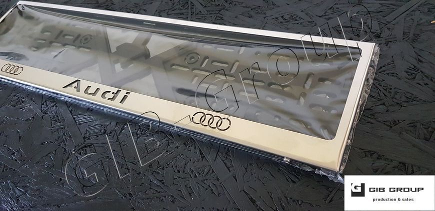 Рамка номерного знаку з написом та логотипом "Audi" 3042 фото