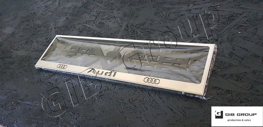 Рамка номерного знаку з написом та логотипом "Audi" 3042 фото