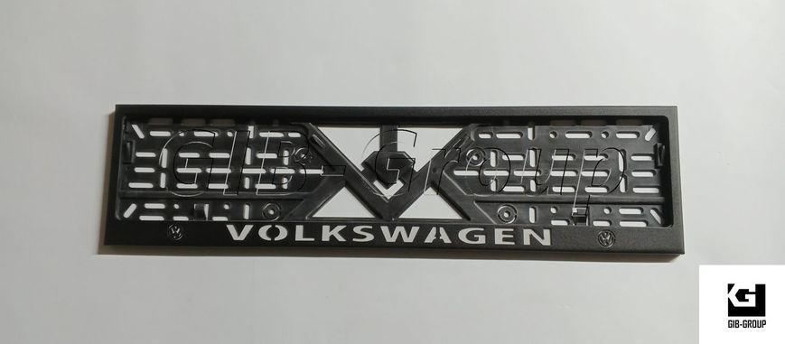 Рамка номерного знаку з написом і логотипом "VOLKSWAGEN" чорна порошкова фарба, напис: білого кольору 16054/L фото