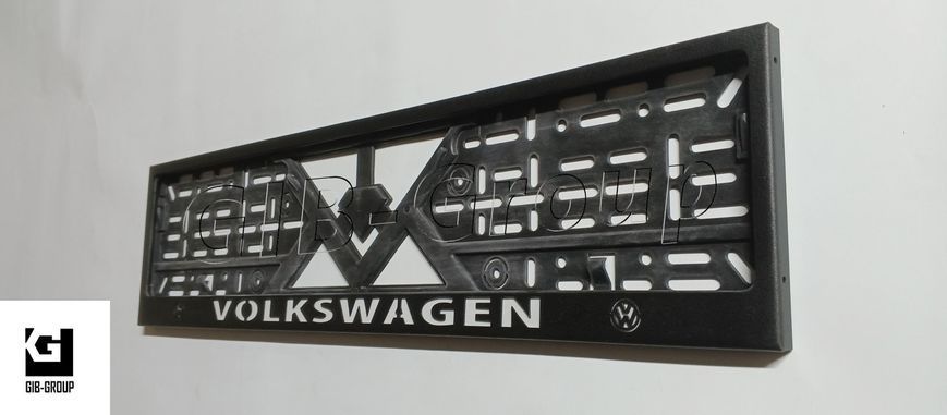 Рамка номерного знаку з написом і логотипом "VOLKSWAGEN" чорна порошкова фарба, напис: білого кольору 16054/L фото