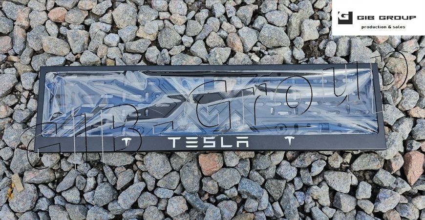 Рамка номерного знаку з написом і логотипом "Tesla" чорне порошкове фарбування, напис: кольору хром 16061 фото