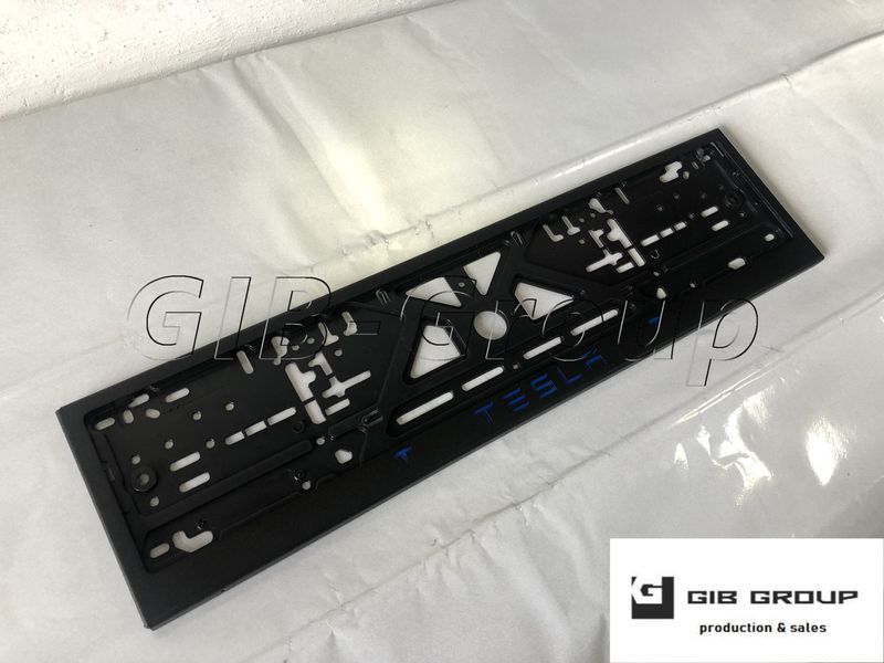 Рамка номерного знака c надписью и логотипом "Tesla" черная порошковая покраска, надпись: синего цвета 16061 фото