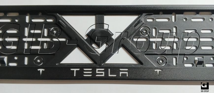 Рамка номерного знаку з написом і логотипом "TESLA" чорна порошкова фарба, напис: білого кольору 16061 фото