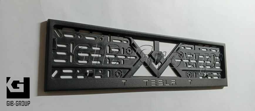 Рамка номерного знаку з написом і логотипом "TESLA" чорна порошкова фарба, напис: білого кольору 16061 фото