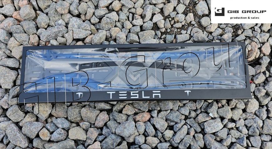 Рамка номерного знаку з написом і логотипом "TESLA" чорна порошкова фарба, напис: білого кольору 16061 фото