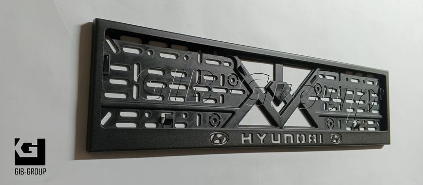 Рамка номерного знаку з написом і логотипом "HYUNDAI" чорна порошкова фарба, напис: білого кольору 16062 фото