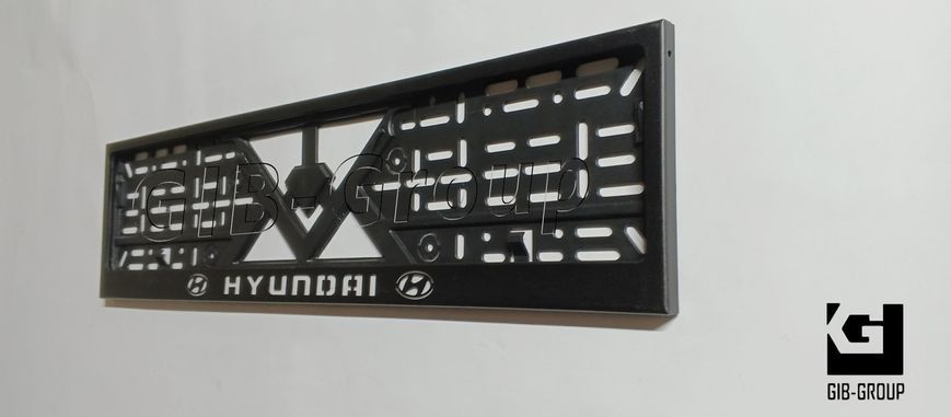 Рамка номерного знаку з написом і логотипом "HYUNDAI" чорна порошкова фарба, напис: білого кольору 16062 фото