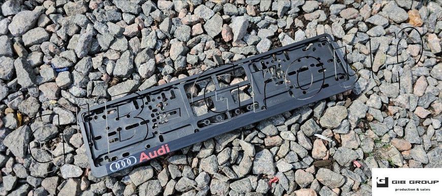 Пластикова рамка номерного знаку з друкованим написом "Audi" 16810 фото