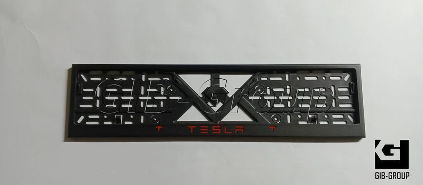 Рамка номерного знака с надписью и логотипом "TESLA" черная порошковая краска, надпись: красного цвета 16061 фото