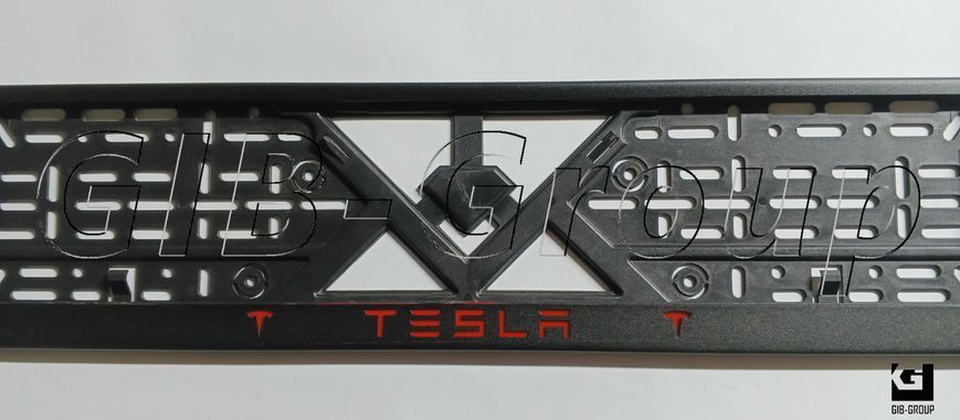 Рамка номерного знака с надписью и логотипом "TESLA" черная порошковая краска, надпись: красного цвета 16061 фото