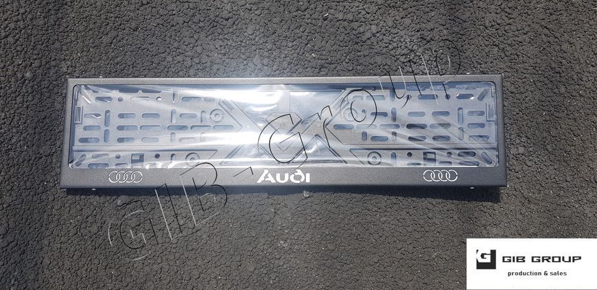 Рамка номерного знака з написом та логотипом "Audi" чорна текстура 15579 фото