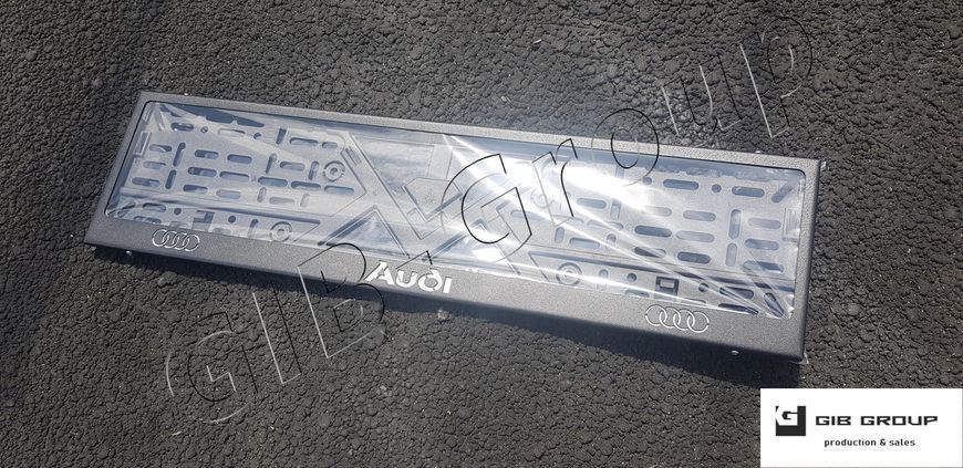Рамка номерного знака з написом та логотипом "Audi" чорна текстура 15579 фото